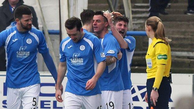 Queen of the South players celebrate Derek Lyle's opening goal.