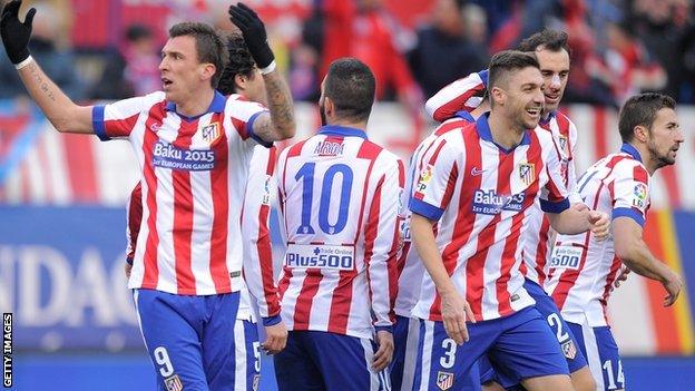 Mario Mandzukic and Atletico Madrid players celebrate their fourth goal against Real Madrid