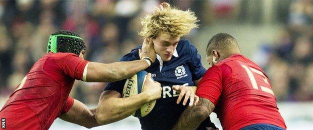 Scotland's Richie Gray is tackled by two French players