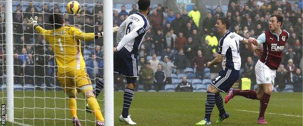 Ashley Barnes (left) heads in the opening goal for Burnley