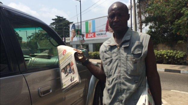 A Nigerian newspaper vender