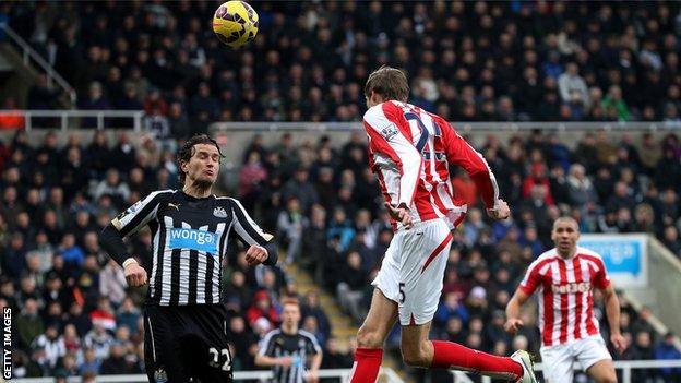 Stoke striker Peter Crouch scores his side's equaliser at Newcastle