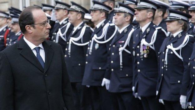 French President Francois Hollande reviews Police officers troops during a ceremony to pay tribute to the three police officers killed in the attacks, in Paris, France, 13 January 2015