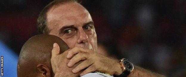 Ghana coach Avram Grant consoles a distraught Andre Ayew