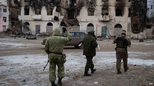 Pro-Russian rebels walk on February 7, 2015 in the eastern Ukrainian town of Vuhlehirsk in the Donetsk region.