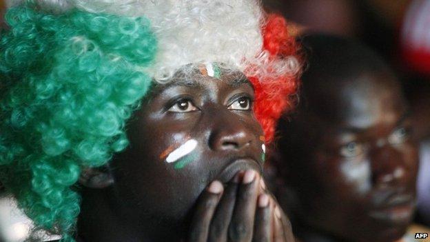 An Ivory Coast fan watches as the team attempt to win the African Cup of Nations final against Ghana