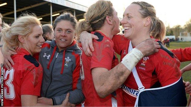 Rachel Taylor and Rebecca Lowe hug after Wales' win over England