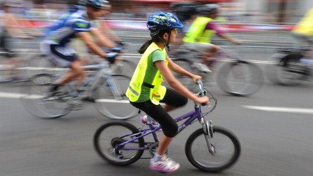 Girl takes part in Prudential RideLondon on August 3, 2013 in London