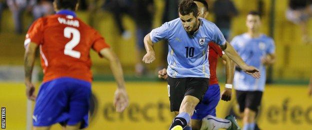 Uruguay's Gaston Pereiro scores against Chile during the South American under-20 Championship