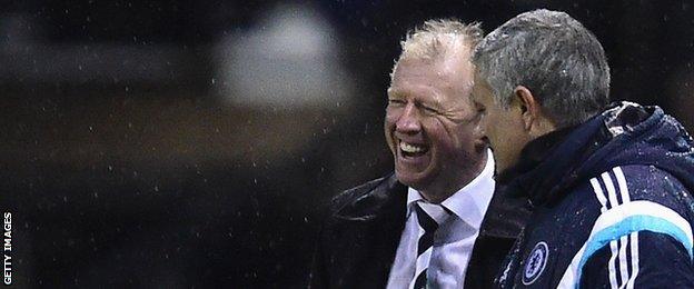 Steve McClaren (left) and Chelsea manager Jose Mourinho discuss the action during the Capital One Cup tie between the sides in December 2014