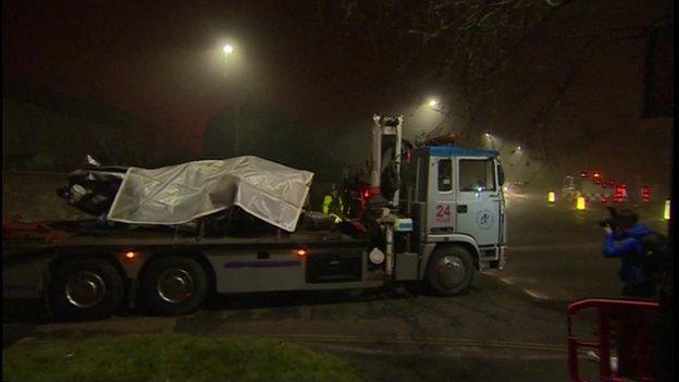 Car being removed from crash scene