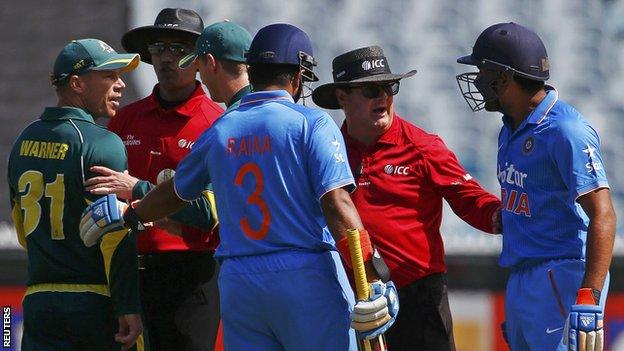 Umpires intervene as Australia's David Warner (left) confronts India's Rohit Sharma (right)