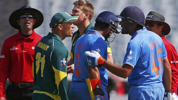 Umpires intervene as Australia's David Warner (left) confronts India's Rohit Sharma (right)