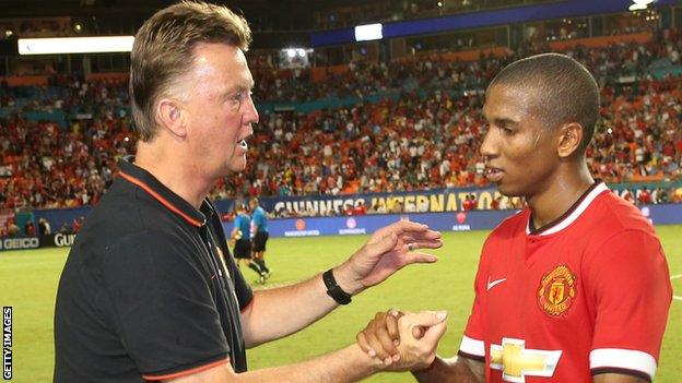 Manchester United manager Louis Van Gaal (left) and winger Ashley Young