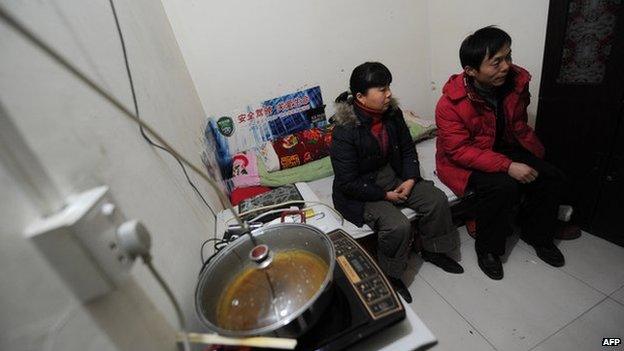 Two residents inside their underground apartment inside an old civil defence shelter