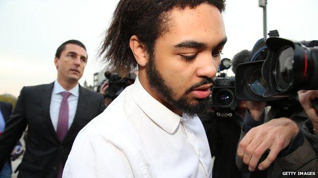 Jejoen Bontinck followed by his lawyer Kris Luyckx, arrives for the first day of the trial of radical Islamic group 'Sharia4Belgium' at the courthouse of Antwerp on 29 September 2014.