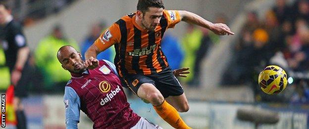 Robbie Brady is tackled by Fabian Delph