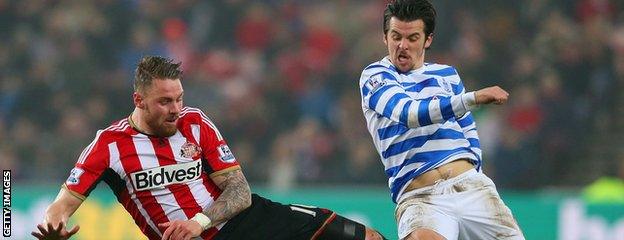 Joey Barton (right) vies for the bal with Connor Wickham