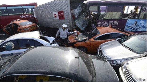 Police officer at scene of crash in Incheon, South Korea (11 Feb 2015)