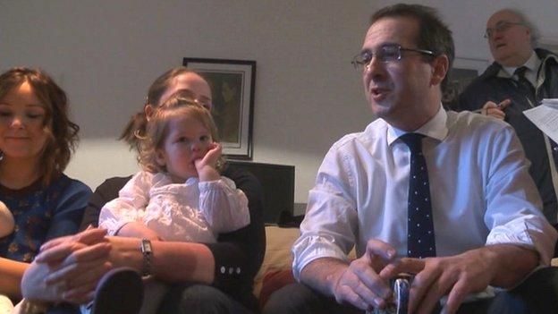 Owen Smith with mothers and children