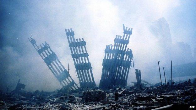 The rubble (ruins, debris, three pronged steel structures) of the World Trade Center smoulders following a terrorist attack on 11th September 2001