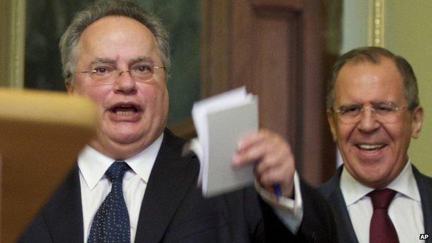 Greece's new Foreign Minister Nikos Kotzias, left, and Russian Foreign Minister Sergei Lavrov arrive for a news conference after their talks in Moscow, Russia, on 11 February 2015