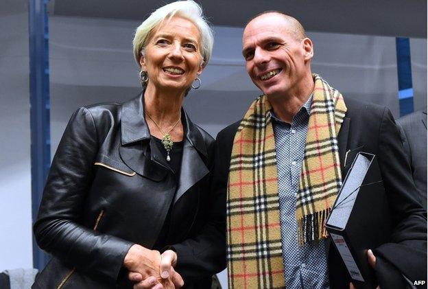 Greek Finance Minister Yanis Varoufakis (right) shakes hands with International Monetary Fund (IMF) Director Christine Lagarde during an emergency Eurogroup finance ministers meeting at the European Council in Brussels on 11 February 2015.