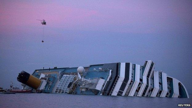 A helicopter approaches the Costa Concordia cruise ship off the west coast of Italy - 19 January 2012
