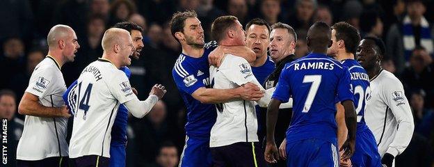 Branislav Ivanovic grabs James McCarthy in a headlock