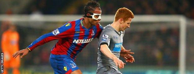 Marouane Chamakh vies for the ball with Jack Colback