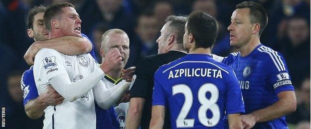 Branislav Ivanovic grabs James McCarthy in a headlock