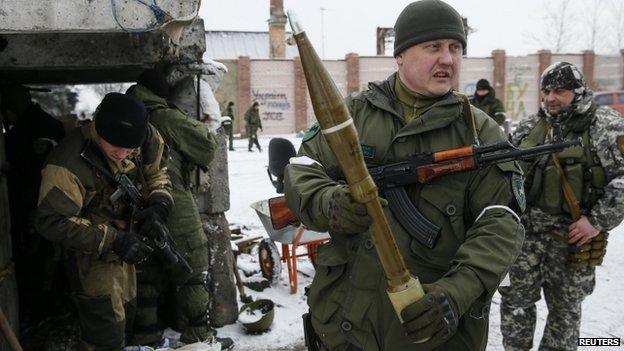 A pro-Russian separatist shows an anti-tank missile in the town of Vuhlehirsk, eastern Ukraine