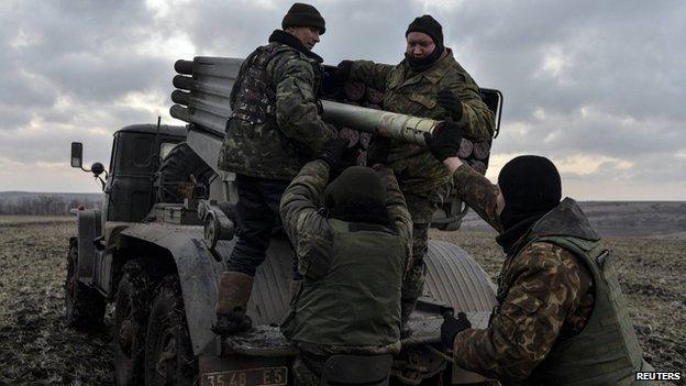 Ukrainian servicemen load Grad rockets near Debaltseve, 8 Feb 15