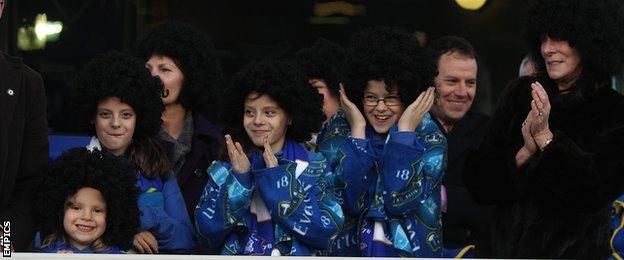Fans wearing Fellaini wigs