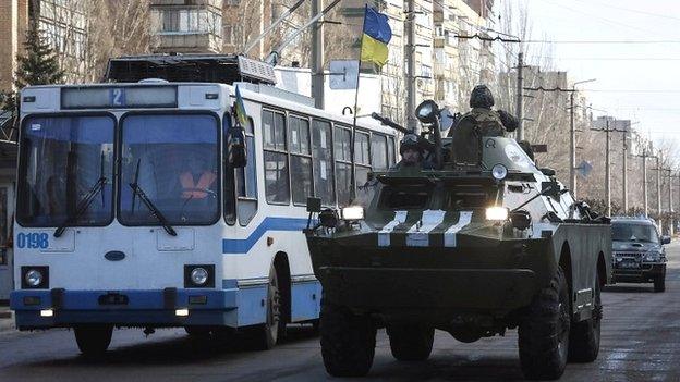 Members of the Ukrainian armed forces ride on an armoured personnel carrier in Kramatorsk - 11 February 2015