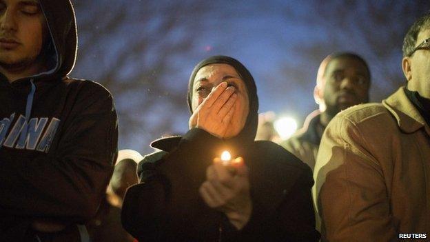 A woman cries as a video is played during a vigil on the campus of the University of North Carolina, for Deah Shaddy Barakat, his wife Yusor Mohammad and Yusor"s sister Razan Mohammad Abu-Salha who were killed in Chapel Hill, North Carolina February 11, 2015.