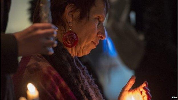 Mourners hold candles during a vigil on the campus of the University of North Carolina in memory of Deah Shaddy Barakat, Yusor Mohammad Abu-Salha, and Razan Mohammad Abu-Salha who were shot dead at a nearby condominium complex in Chapel Hill, North Carolina, USA, 11 February 2015