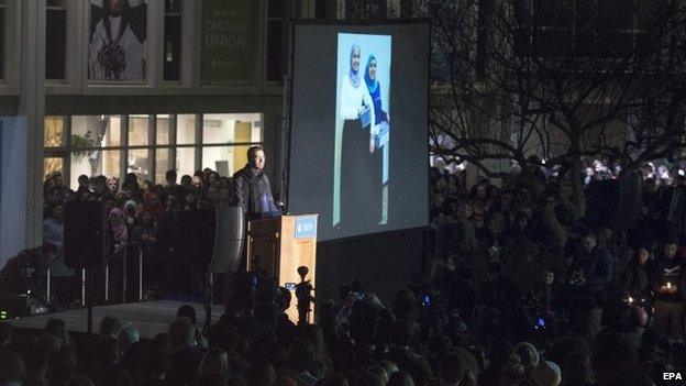 A vigil is underway at "The Pit" on the campus of the University of North Carolina in memory of Deah Shaddy Barakat, Yusor Mohammad Abu-Salha, and Razan Mohammad Abu-Salha 11 February 2015.