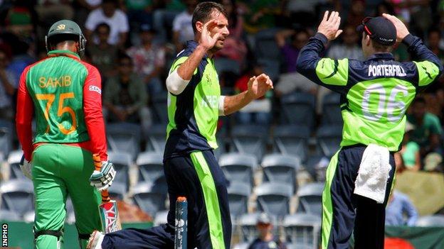 Bangladesh batsman Shakib Al Hasan walks off as Max Sorensen celebrates taking his wicket