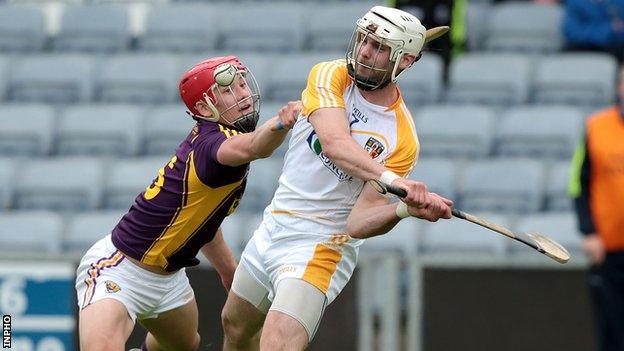 Neil McManus is challenged by Wexford's Lee Chin in last year's Leinster Championship game