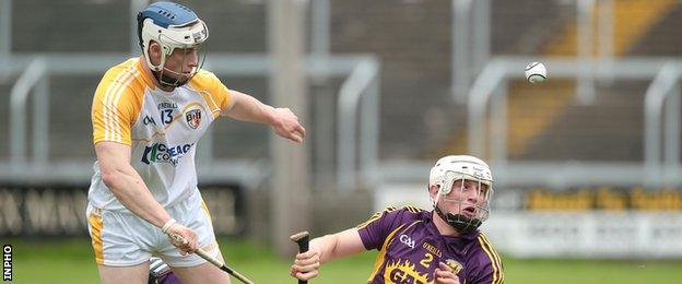 Conor Johnson battles with Wexford's Liam Ryan in last summer's Leinster Championship game