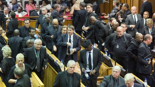 Members of South Africa's Democratic Alliance walk out of parliament