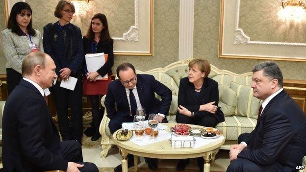 Russian President Vladimir Putin, France"s President Francois Hollande, German Chancellor Angela Merkel and Ukrainian President Petro Poroshenko (L-R) attend a meeting on February 11, 2015 in Minsk