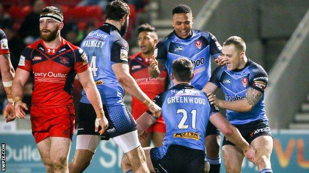 St Helens celebrate their try against Salford