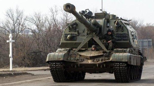 Ukrainian servicemen patrol with a self-propelled artillery gun near the eastern Ukrainian town of Debaltseve, in the region of Donetsk , on February 8, 2015