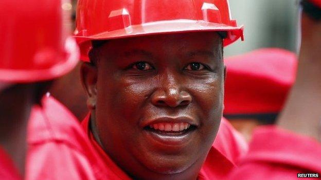 Economic Freedom Fighters (EFF) leader Julius Malema arrives with members of his party for President Jacob Zuma"s State of the Nation address in Cape Town February 12, 2015.