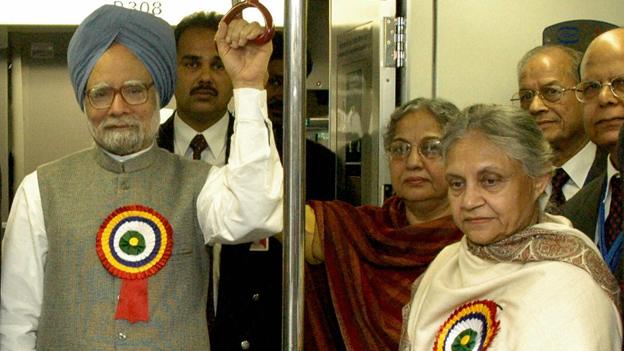 Manmohan Singh (L), his wife Gursharan Kaur (C) and Delhi's Chief Minister Sheila Dikshit (R) ride on board a metro train, during the inauguration of the first underground section of New Delhi's Metro, at Vidhan Sabha Station,19 December 2004