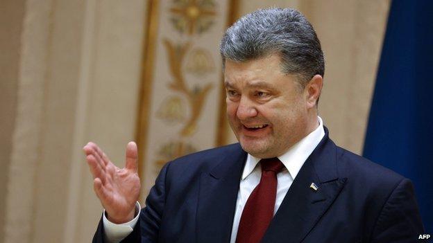 Ukrainian President Petro Poroshenko speaks during a press conference after a summit aimed at ending 10 months of fighting in Ukraine in Minsk on 12 February, 2015