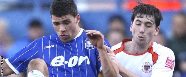 Shaun Barker (right) in action for Blackpool