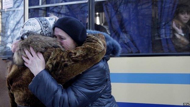 Women hug each other as they wait to evacuate to Russia from Donetsk, Ukraine - 13 February 2015